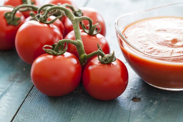 Tomatoes paste and bunch fresh tomatoes