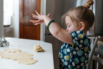 A child playing with cookie dough