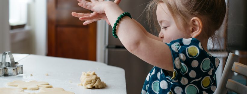 A child playing with cookie dough
