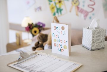 Picture of a get well soon card in a hospital room.