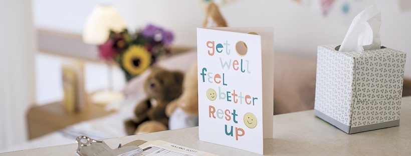 Picture of a get well soon card in a hospital room.