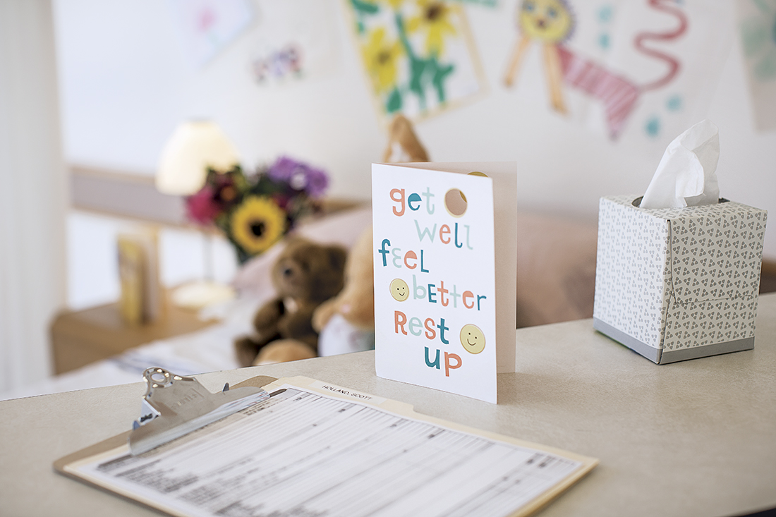 Picture of a get well soon card in a hospital room.