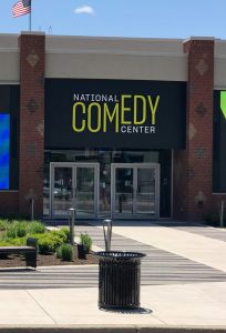 Picture of the front of a building that is the National Comedy Center