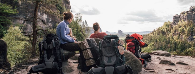 Picture of a family on top of a mountain