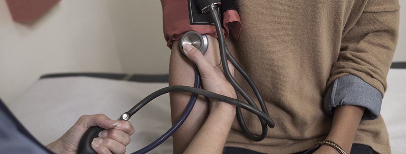 Picture of a woman getting her blood pressure taken