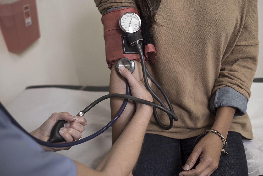 Picture of a woman getting her blood pressure taken