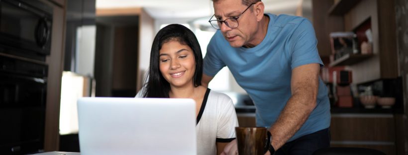 Picture of a dad helping child with homework