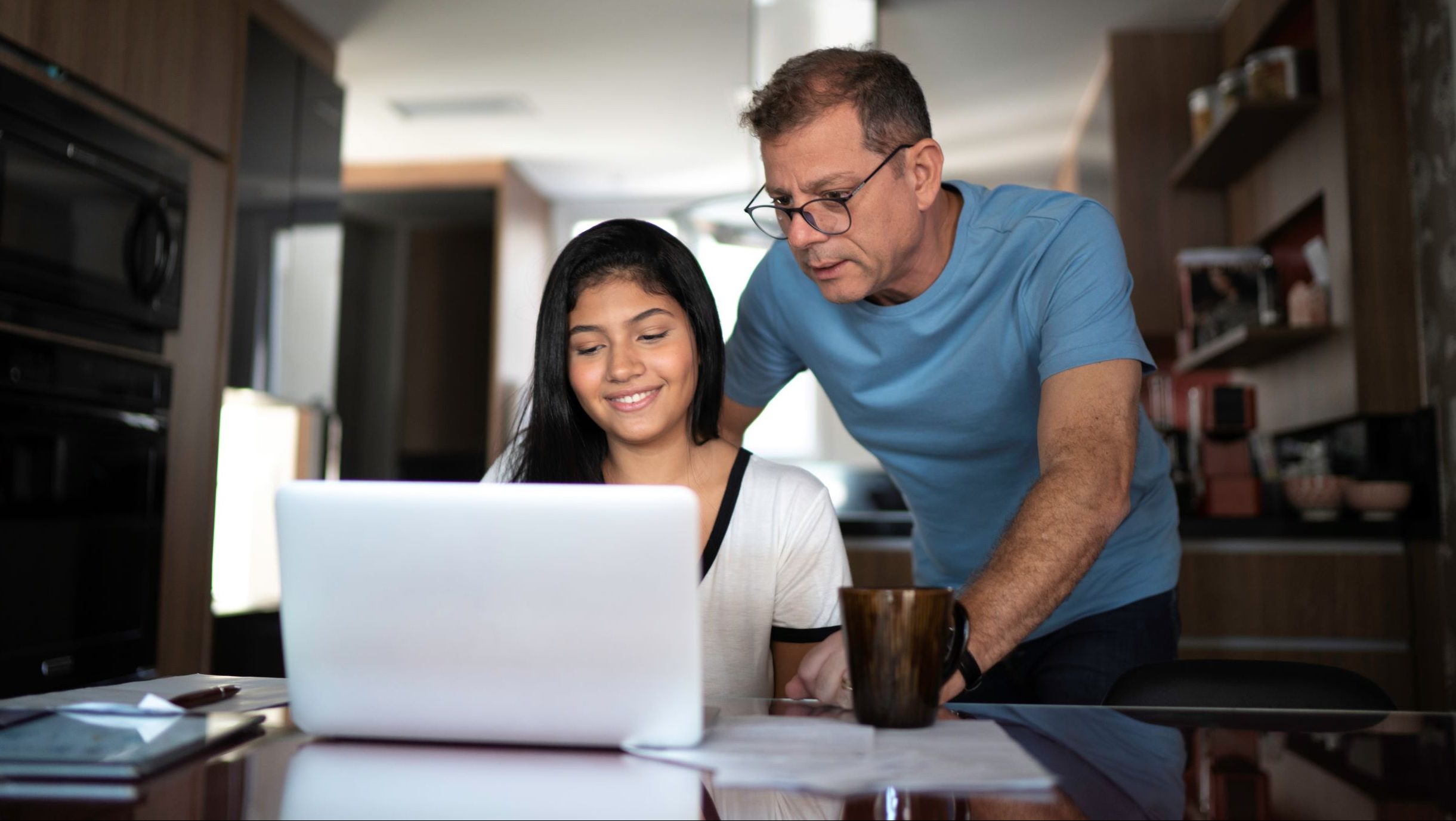 Picture of a dad helping child with homework