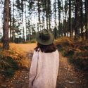 Picture of a woman walking alone in the woods