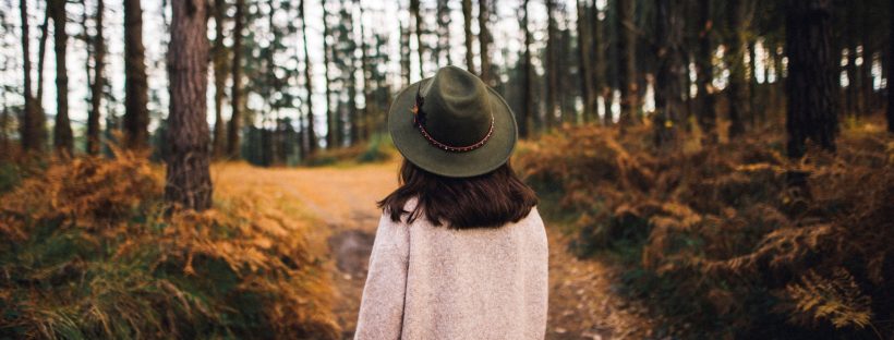 Picture of a woman walking alone in the woods