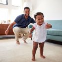 Picture of a dad and baby girl dancing