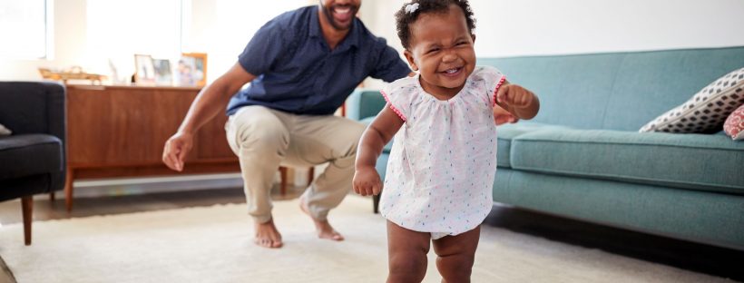 Picture of a dad and baby girl dancing