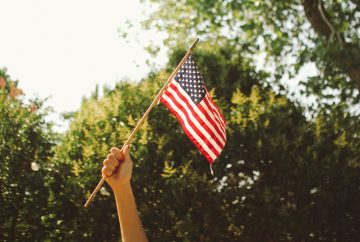 Picture of someone holding an American flag