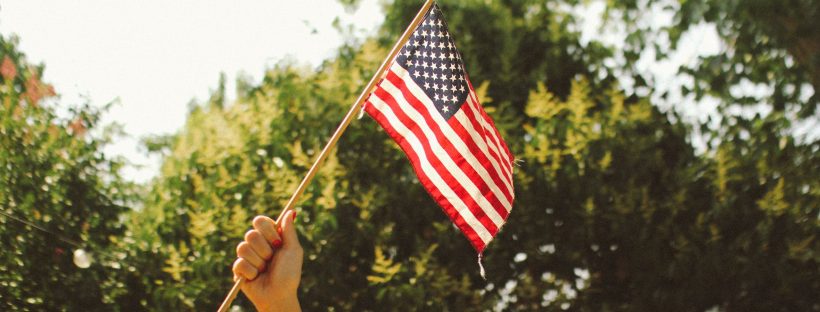 Picture of someone holding an American flag