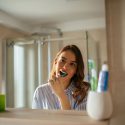 Girl brushing her teeth