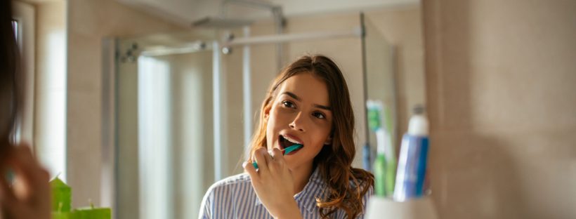 Girl brushing her teeth