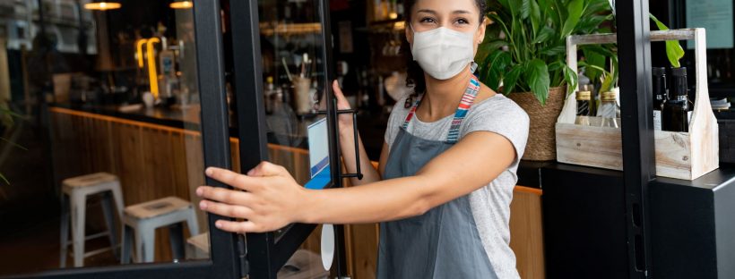 Picture of woman in mask opening door