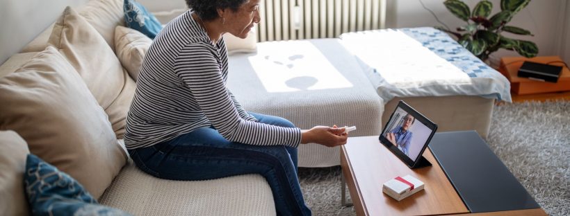 Woman using telehealth to talk to doctor