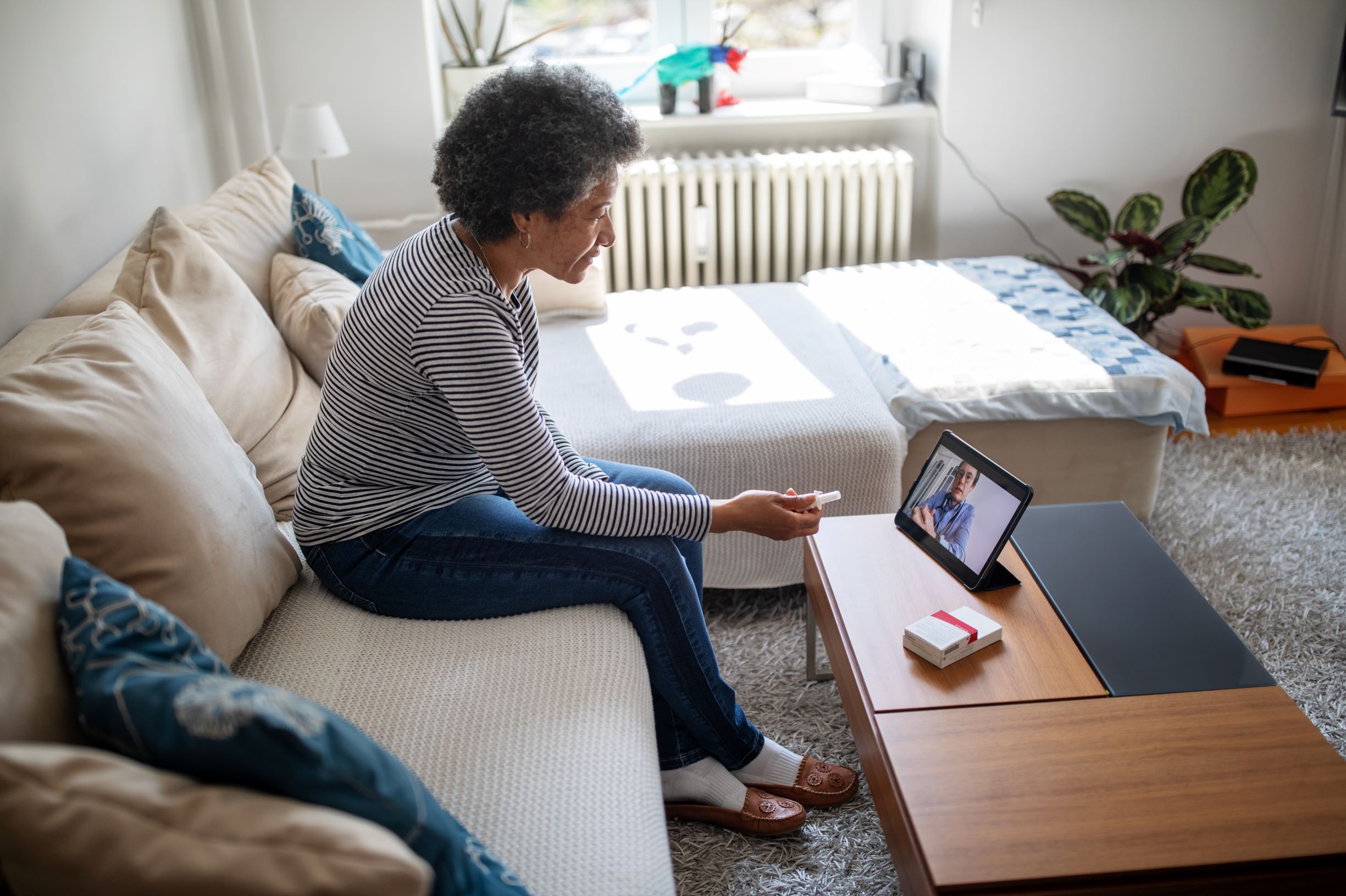 Woman using telehealth to talk to doctor