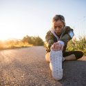 Runner sitting and stretching