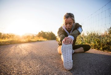 Runner sitting and stretching