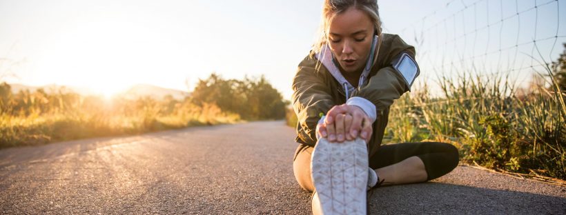 Runner sitting and stretching