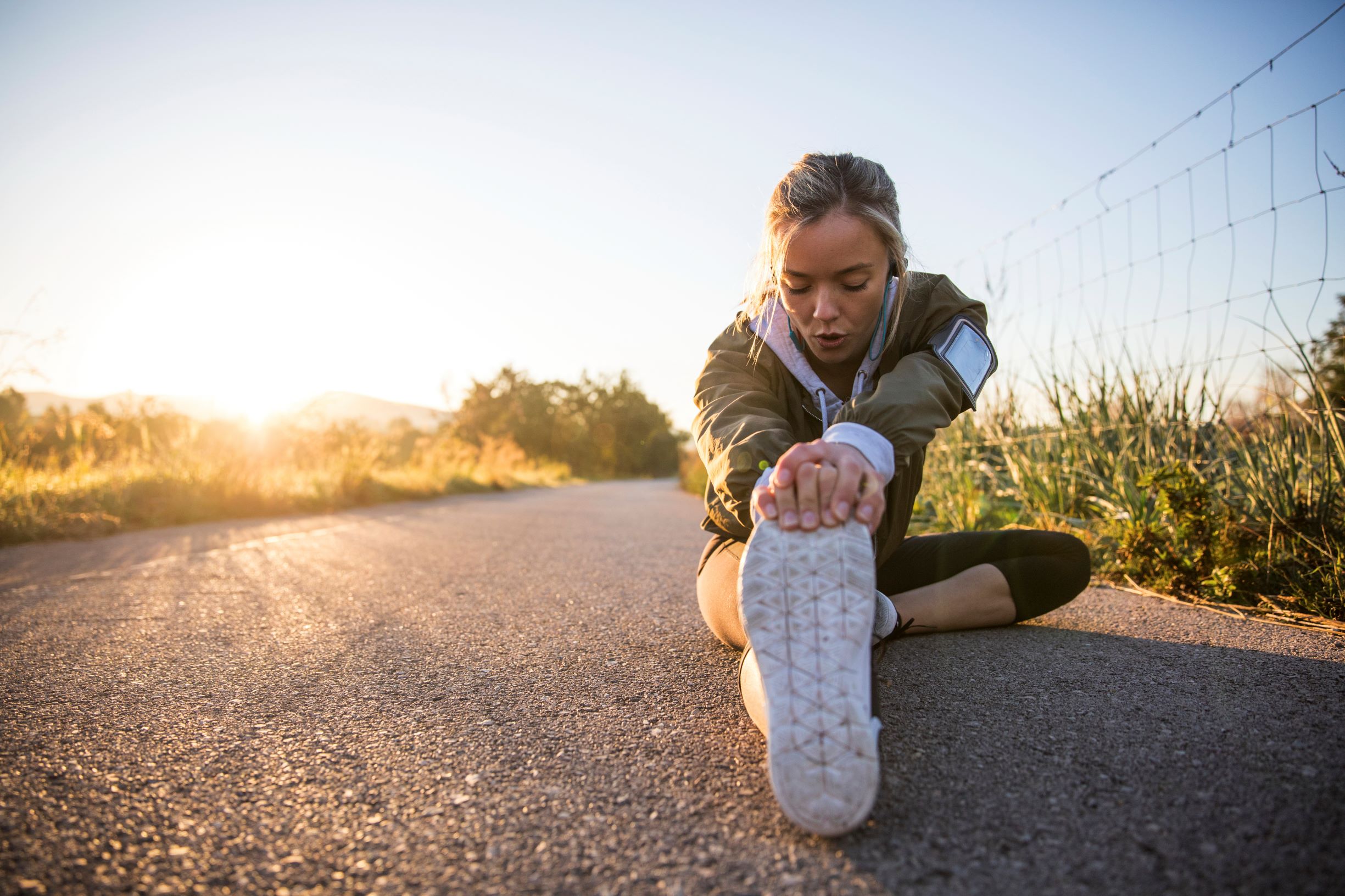 Runner sitting and stretching