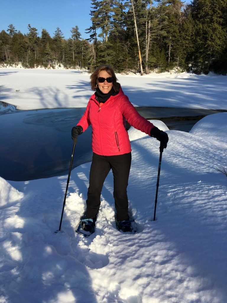 Picture of a woman snowshowing