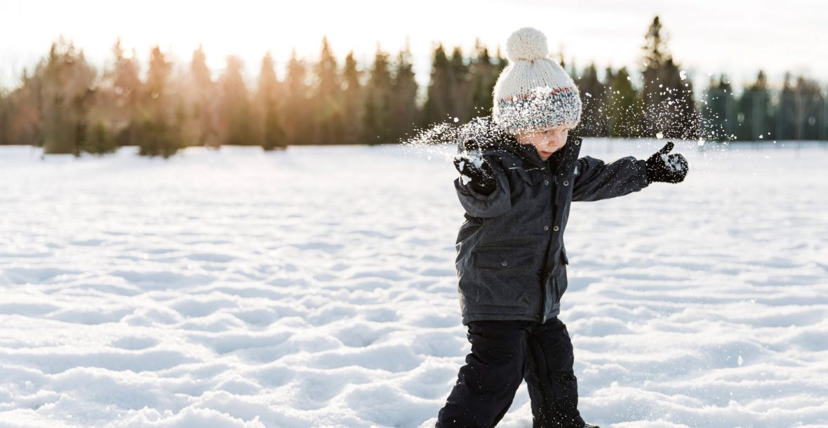 boy playing in snow