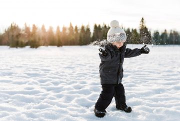 boy playing in snow