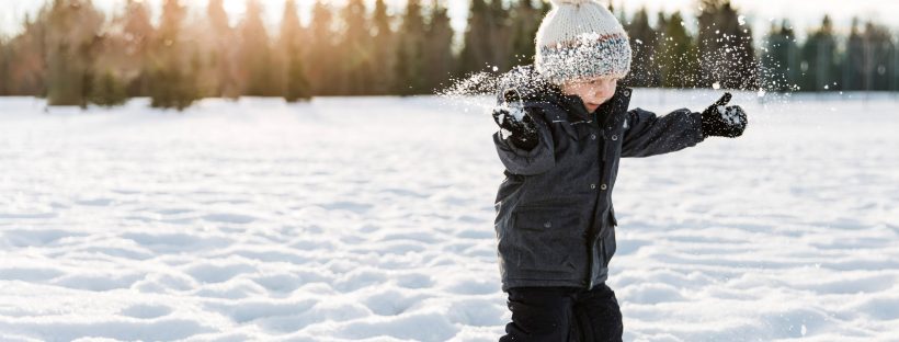 boy playing in snow